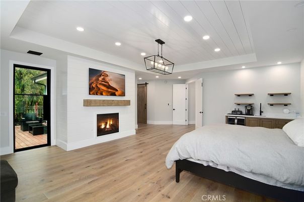 Bedroom, Fireplace, Interior, Pendant Lights, Recessed Lighting, Wood Texture Flooring