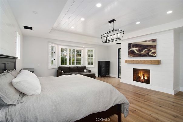 Bedroom, Fireplace, Interior, Pendant Lights, Recessed Lighting, Wood Texture Flooring