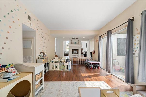Dining room, Fireplace, Interior, Living room, Recessed Lighting, Wood Texture Flooring