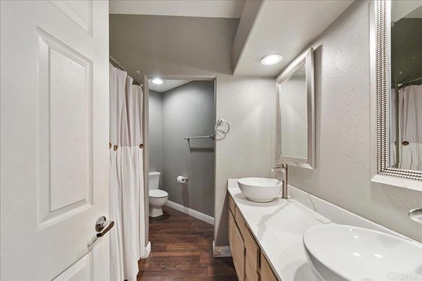 Bathroom, Dual Sink Vanities, Interior, Recessed Lighting, Wood Texture Flooring