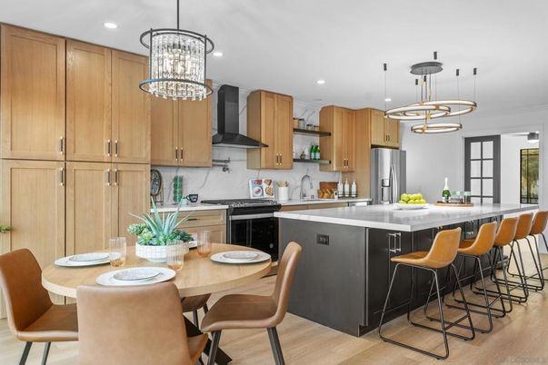 Chandelier, Dining room, Interior, Kitchen, Pendant Lights, Recessed Lighting, Stainless Steel Appliances, Wood Texture Flooring