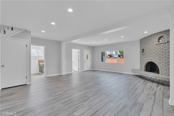 Empty room, Fireplace, Interior, Recessed Lighting, Stone Walls, Wood Texture Flooring