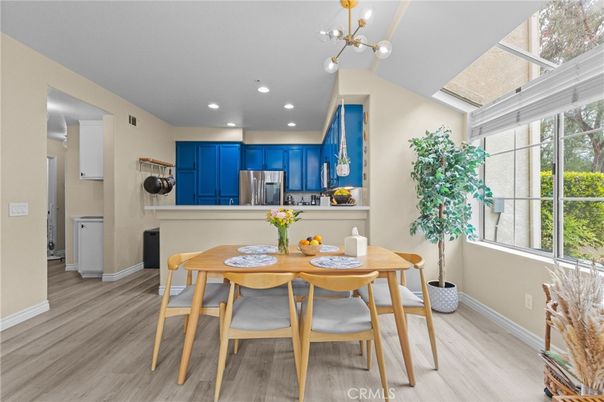 Dining room, Interior, Kitchen, Pendant Lights, Recessed Lighting, Stainless Steel Appliances, Wood Texture Flooring