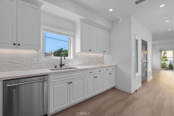 Interior, Kitchen, Marble Walls, Recessed Lighting, Stainless Steel Appliances, Wood Texture Flooring