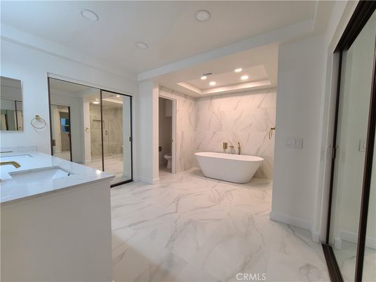 Bathroom, Dual Sink Vanities, Free Standing Baths, Glass Shower, Interior, Marble, Marble Walls, Recessed Lighting