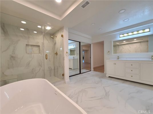 Bathroom, Dual Sink Vanities, Free Standing Baths, Glass Shower, Interior, Marble, Marble Walls, Recessed Lighting