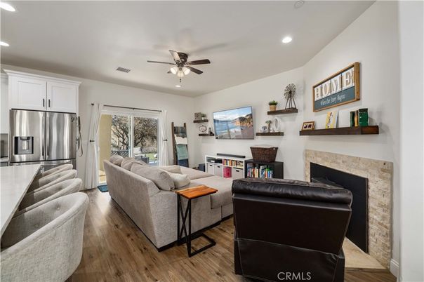 Fireplace, Interior, Kitchen, Living room, Recessed Lighting, Stainless Steel Appliances, Wood Texture Flooring