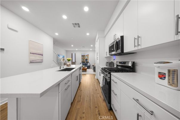 Interior, Kitchen, Recessed Lighting, Stainless Steel Appliances, Wood Texture Flooring