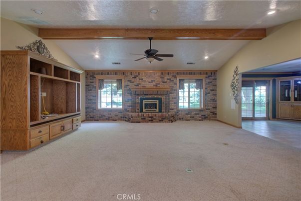 Empty room, Fireplace, Interior, Recessed Lighting, Stone Walls, Wooden Beams