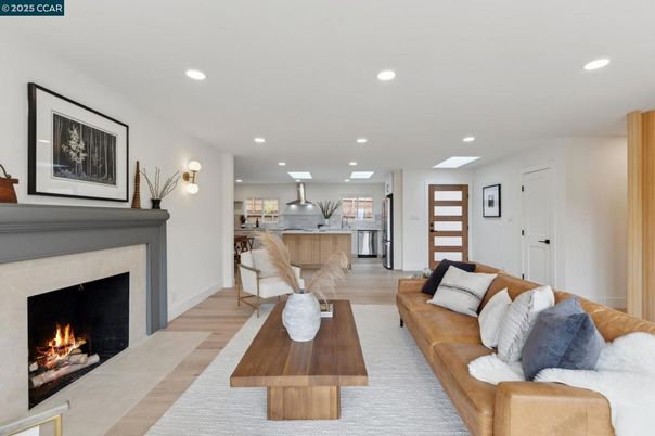 Fireplace, Interior, Kitchen, Living room, Recessed Lighting, Stainless Steel Appliances, Wood Texture Flooring