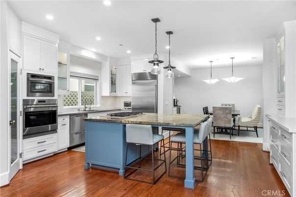 Dining room, Interior, Kitchen, Pendant Lights, Recessed Lighting, Stainless Steel Appliances, Wood Texture Flooring