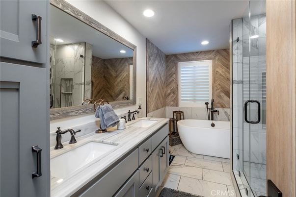 Bathroom, Dual Sink Vanities, Free Standing Baths, Glass Shower, Interior, Marble, Marble Walls, Recessed Lighting