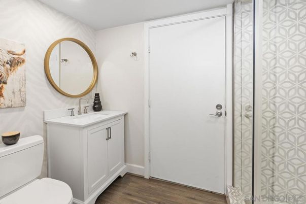 Bathroom, Interior, Recessed Lighting, Washer, Wood Texture Flooring