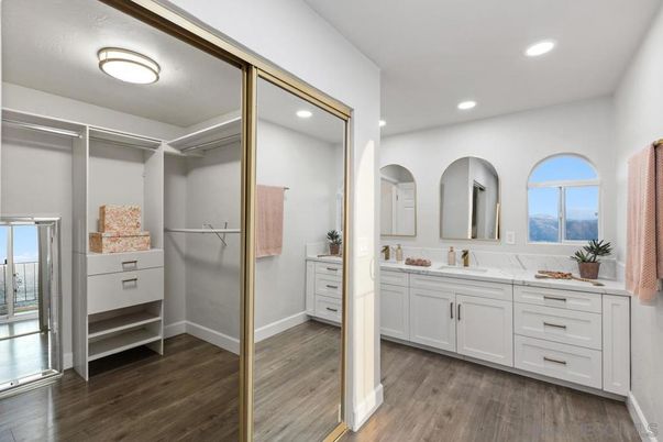 Bathroom, Dual Sink Vanities, Interior, Recessed Lighting, Walk-in Closets, Wood Texture Flooring