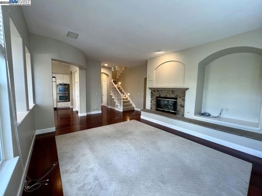 Empty room, Fireplace, Interior, Kitchen, Recessed Lighting, Wood Texture Flooring