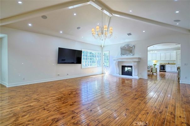 Chandelier, Empty room, Fireplace, Interior, Recessed Lighting, Wood Texture Flooring