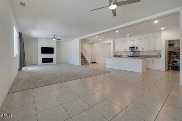 Empty room, Fireplace, Interior, Kitchen, Recessed Lighting, Stainless Steel Appliances
