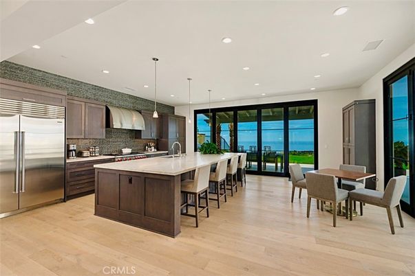 Dining room, Interior, Kitchen, Pendant Lights, Recessed Lighting, Stainless Steel Appliances, Water, Wood Texture Flooring