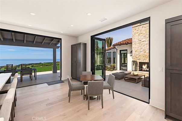 Dining room, Fireplace, Interior, Living room, Recessed Lighting, Water, Wood Texture Flooring