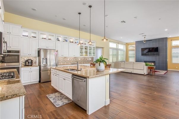 Fireplace, Interior, Kitchen, Pendant Lights, Recessed Lighting, Stainless Steel Appliances, Wood Texture Flooring