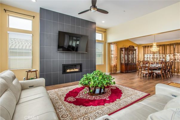 Dining room, Fireplace, Interior, Living room, Pendant Lights, Recessed Lighting, Wood Texture Flooring