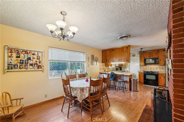 Chandelier, Dining room, Fireplace, Interior, Kitchen, Stone Walls, Wood Texture Flooring