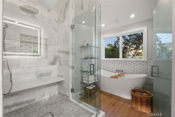 Bathroom, Free Standing Baths, Glass Shower, Interior, Marble Walls, Recessed Lighting, Wood Texture Flooring