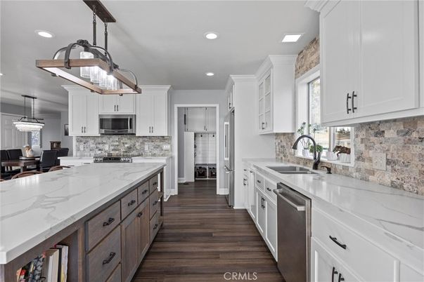 Dining room, Interior, Kitchen, Pendant Lights, Recessed Lighting, Stainless Steel Appliances, Wood Texture Flooring