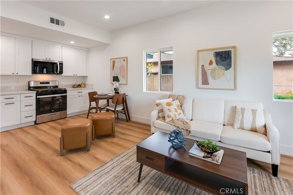 Dining room, Interior, Kitchen, Living room, Recessed Lighting, Stainless Steel Appliances, Wood Texture Flooring