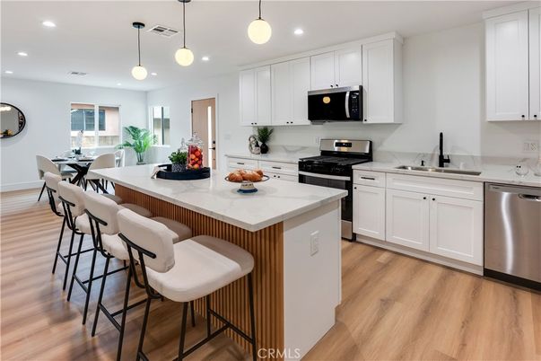 Dining room, Interior, Kitchen, Pendant Lights, Recessed Lighting, Stainless Steel Appliances, Wood Texture Flooring