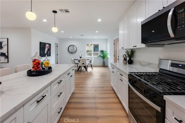 Dining room, Interior, Kitchen, Pendant Lights, Recessed Lighting, Stainless Steel Appliances, Wood Texture Flooring