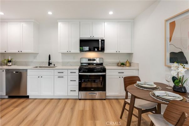 Dining room, Interior, Kitchen, Recessed Lighting, Stainless Steel Appliances, Wood Texture Flooring