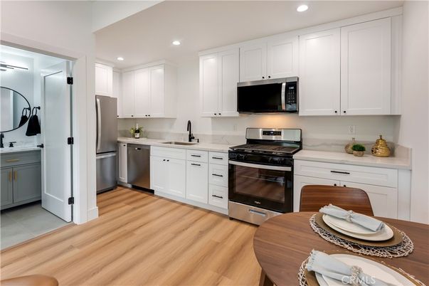 Interior, Kitchen, Recessed Lighting, Stainless Steel Appliances, Wood Texture Flooring