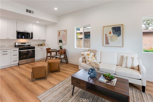 Dining room, Interior, Kitchen, Living room, Recessed Lighting, Stainless Steel Appliances, Wood Texture Flooring
