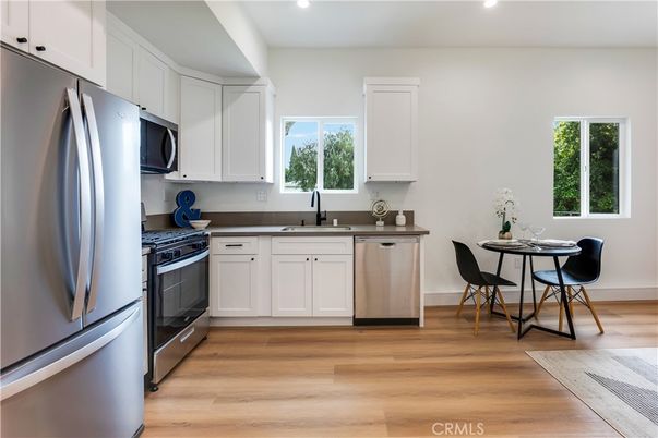 Dining room, Interior, Kitchen, Recessed Lighting, Stainless Steel Appliances, Wood Texture Flooring