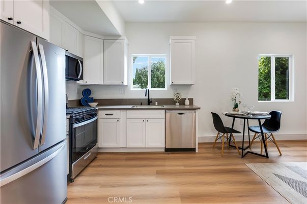 Dining room, Interior, Kitchen, Recessed Lighting, Stainless Steel Appliances, Wood Texture Flooring