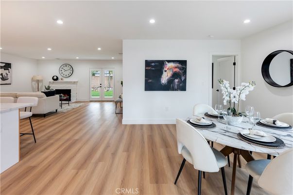 Dining room, Fireplace, Interior, Living room, Recessed Lighting, Wood Texture Flooring