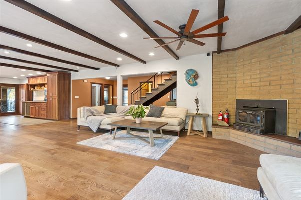 Fireplace, Interior, Living room, Recessed Lighting, Stone Walls, Wooden Beams, Wood Texture Flooring