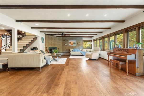 Fireplace, Interior, Living room, Piano, Recessed Lighting, Stone Walls, Wooden Beams, Wood Texture Flooring