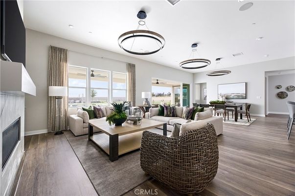 Dining room, Fireplace, Interior, Living room, Pendant Lights, Recessed Lighting, Wood Texture Flooring