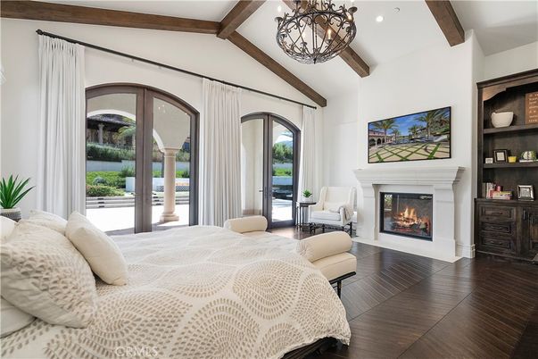 Bedroom, Chandelier, Fireplace, Interior, Recessed Lighting, Wooden Beams, Wood Texture Flooring