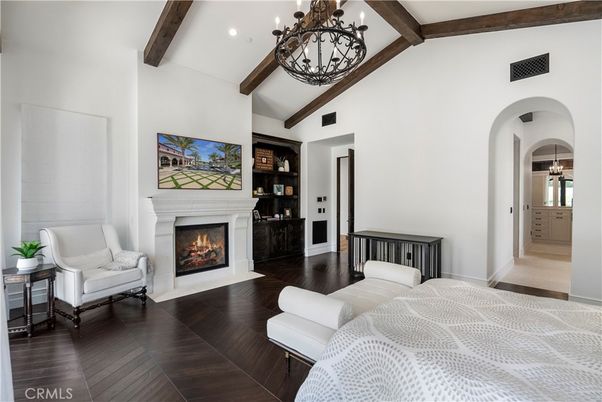 Bedroom, Chandelier, Fireplace, Interior, Recessed Lighting, Wooden Beams, Wood Texture Flooring