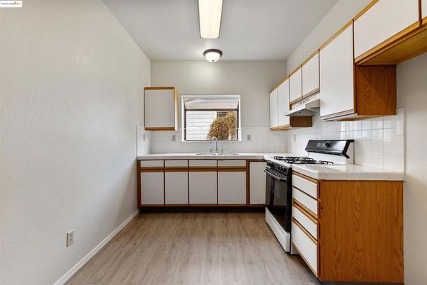 Interior, Kitchen, Tile Countertops, Wood Texture Flooring