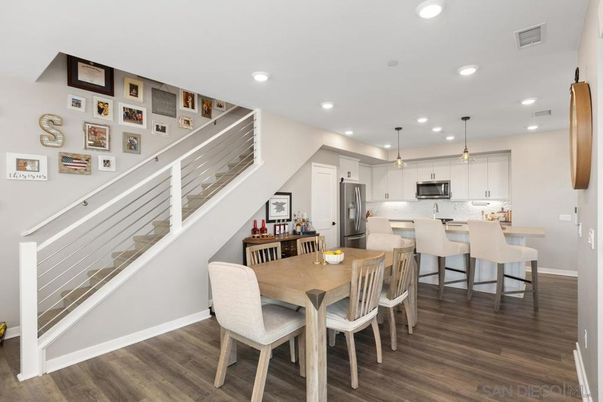 Dining room, Interior, Kitchen, Pendant Lights, Recessed Lighting, Stainless Steel Appliances, Wood Texture Flooring