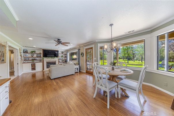 Chandelier, Dining room, Fireplace, Interior, Living room, Recessed Lighting, Wood Texture Flooring
