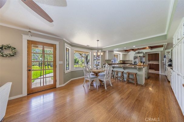 Chandelier, Dining room, Interior, Kitchen, Pendant Lights, Recessed Lighting, Stainless Steel Appliances, Wood Texture Flooring