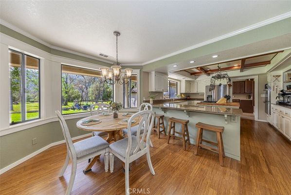 Chandelier, Dining room, Interior, Kitchen, Recessed Lighting, Stainless Steel Appliances, Wood Texture Flooring