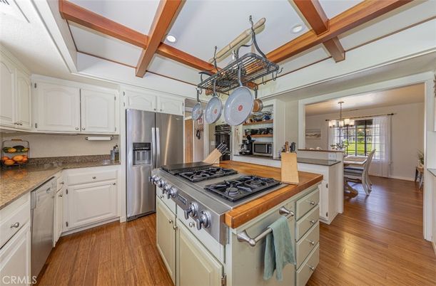 Chandelier, Dining room, Interior, Kitchen, Pendant Lights, Recessed Lighting, Stainless Steel Appliances, Wooden Beams, Wood Texture Flooring