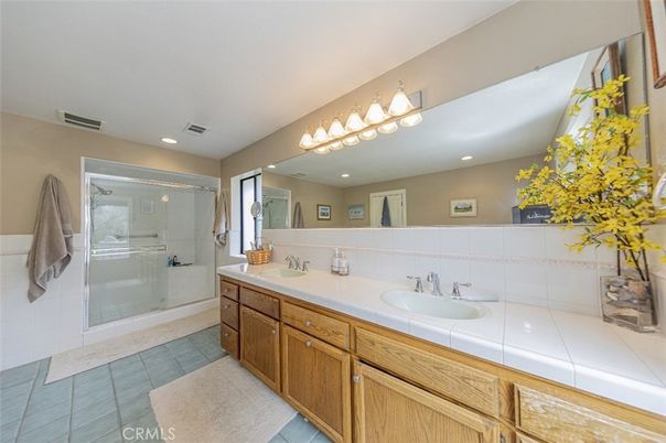 Bathroom, Dual Sink Vanities, Glass Shower, Interior, Recessed Lighting, Tile Countertops