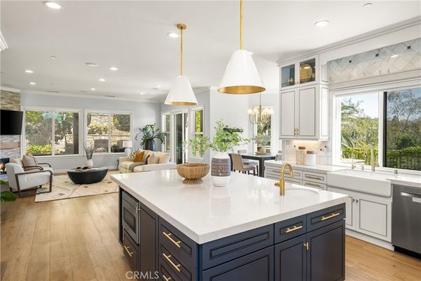 Dining room, Fireplace, Interior, Kitchen, Living room, Pendant Lights, Recessed Lighting, Stainless Steel Appliances, Wood Texture Flooring